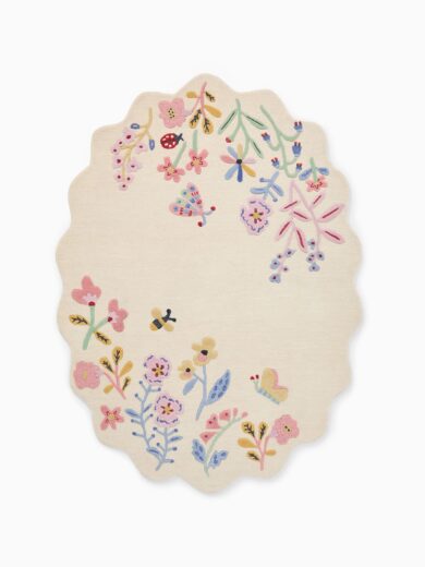 Scalloped kids rug with floral garden design, butterflies, and pastel colors, made with eco-friendly natural dyes, soft plush rug for nursery decor.