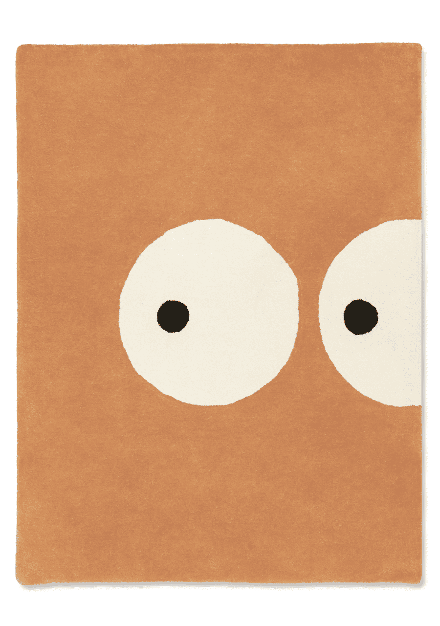 Kids rug with cute eyes design in warm orange tone, made with eco-friendly natural dyes, soft plush rug for nursery, kids room, and playroom decor.